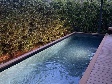 Dark liner pool with a timber deck