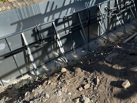 Steel panels with support buttresses