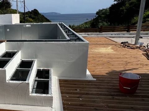 Small raised pool with a sea view